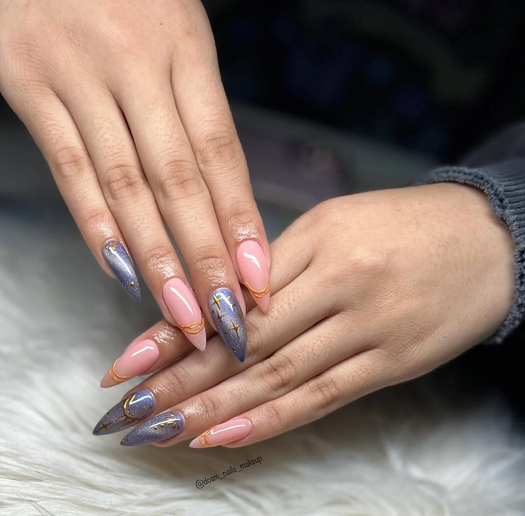 Long almond nails with lavender shimmer, pink bases and gold star accents