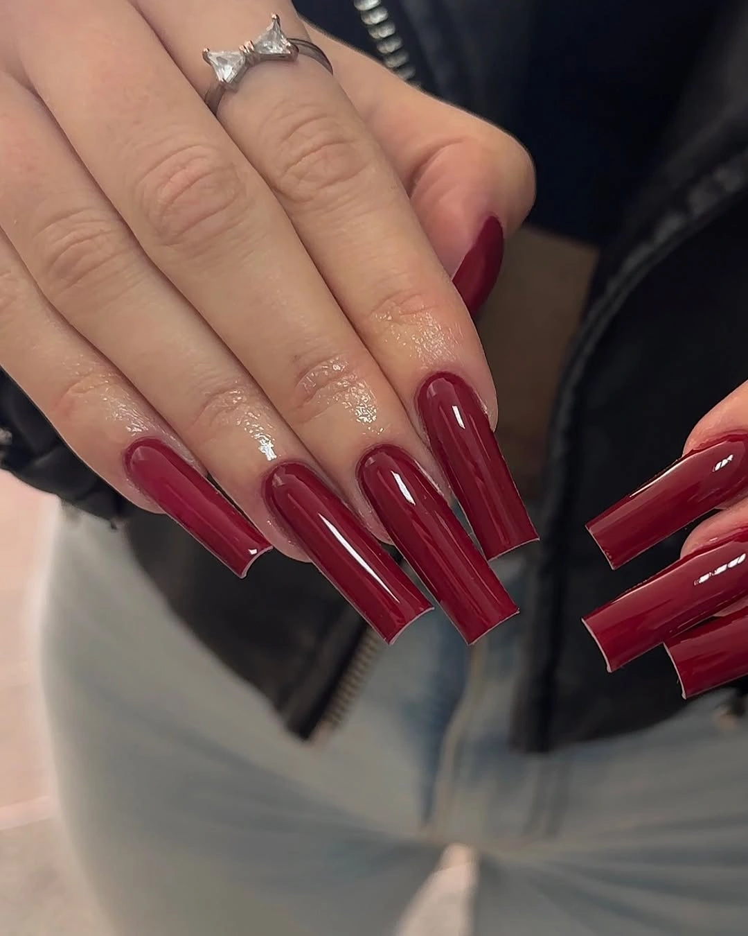 Extremely long square nails in uniform glossy deep burgundy red