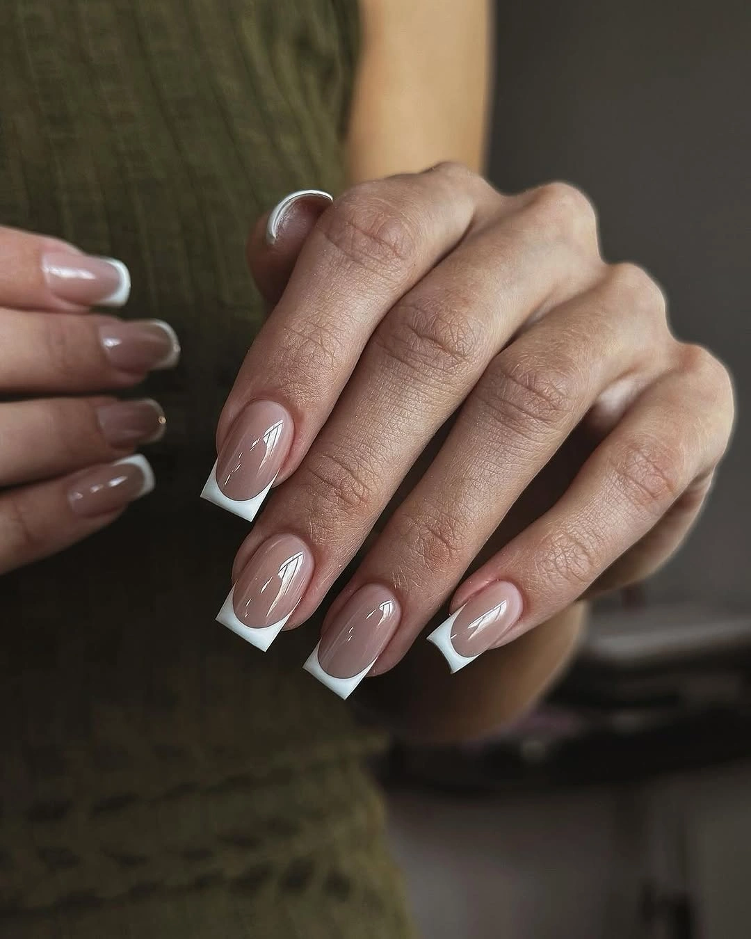 Medium square taupe nude nails with sharply angled white French tips
