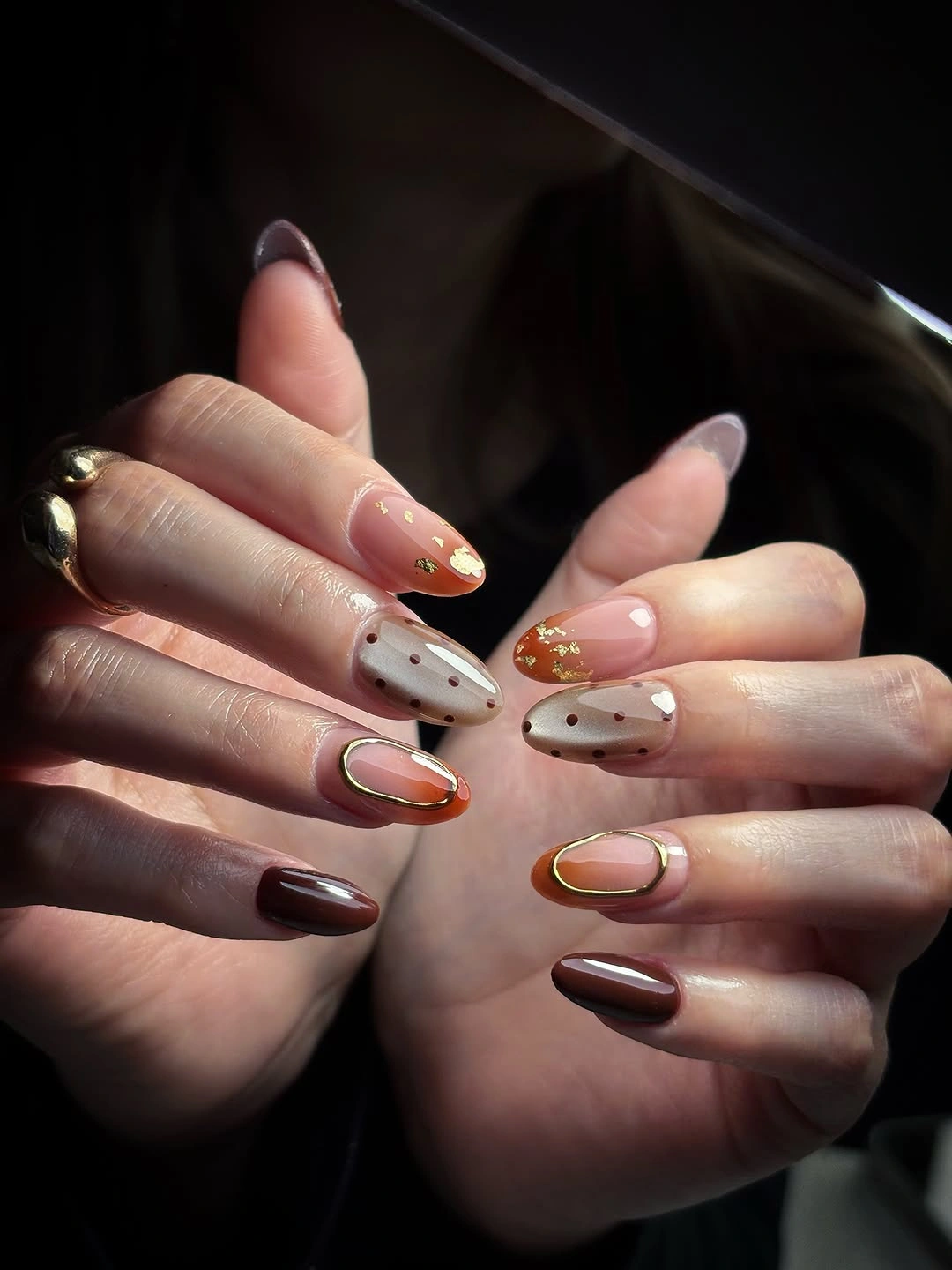Almond nails in dark burgundy with dotted cream and amber curved tips