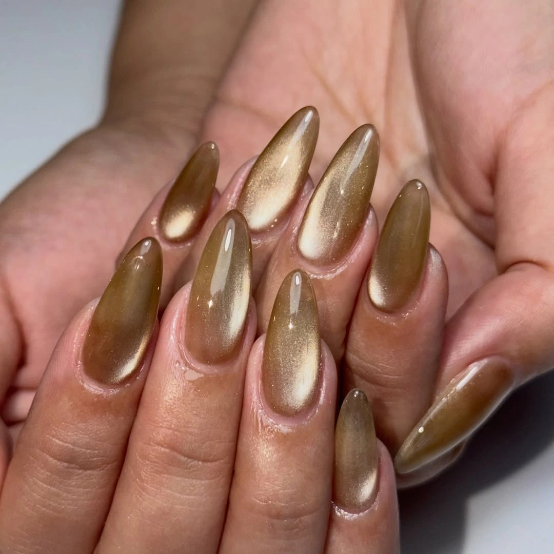 Long almond nails in bronze olive with pale gold reflective centers